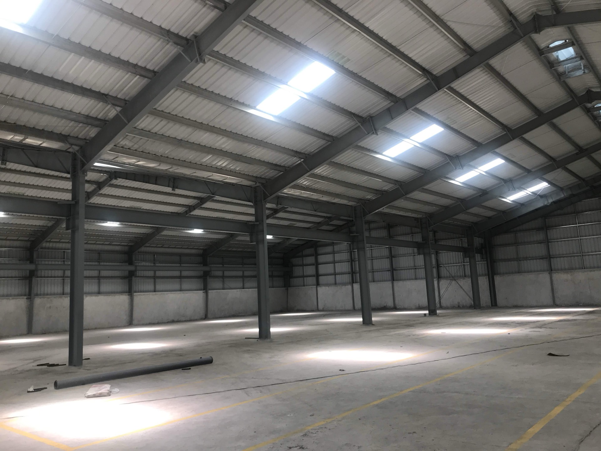 Steel roof structure and portal frames inside a VisionOne industrial warehouse