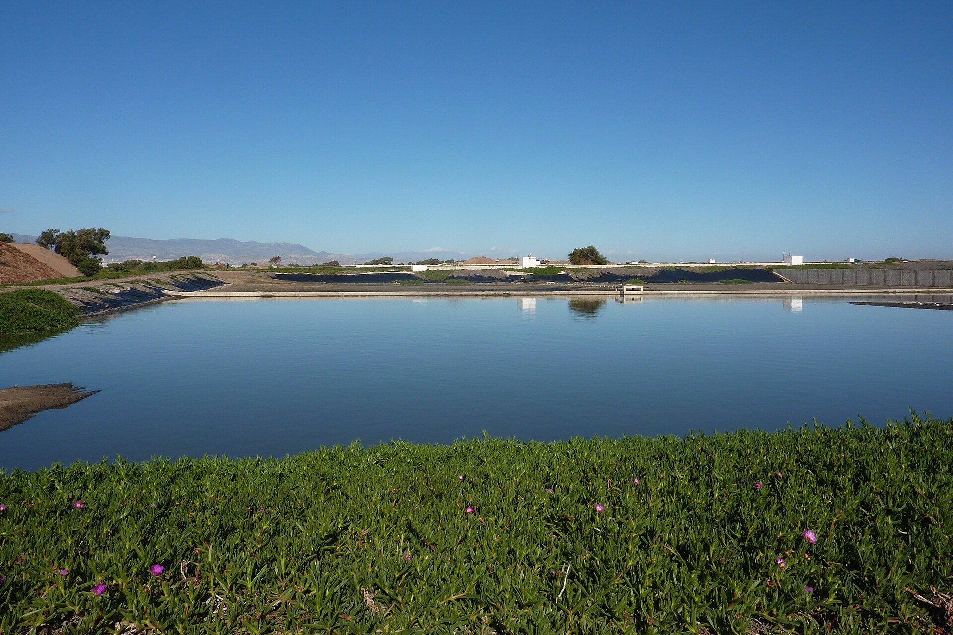 A lined waste-stabilisation pond with inlet structure at a treatment works